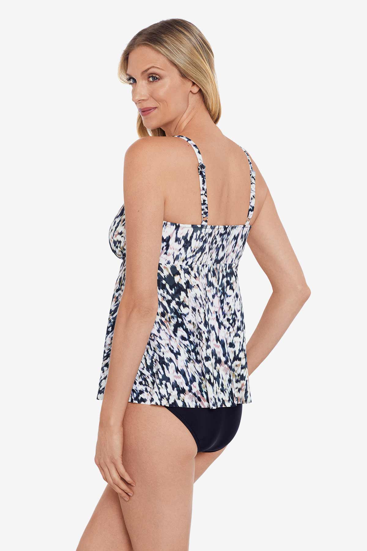 Woman turned left wearing a leopard printed tankini top