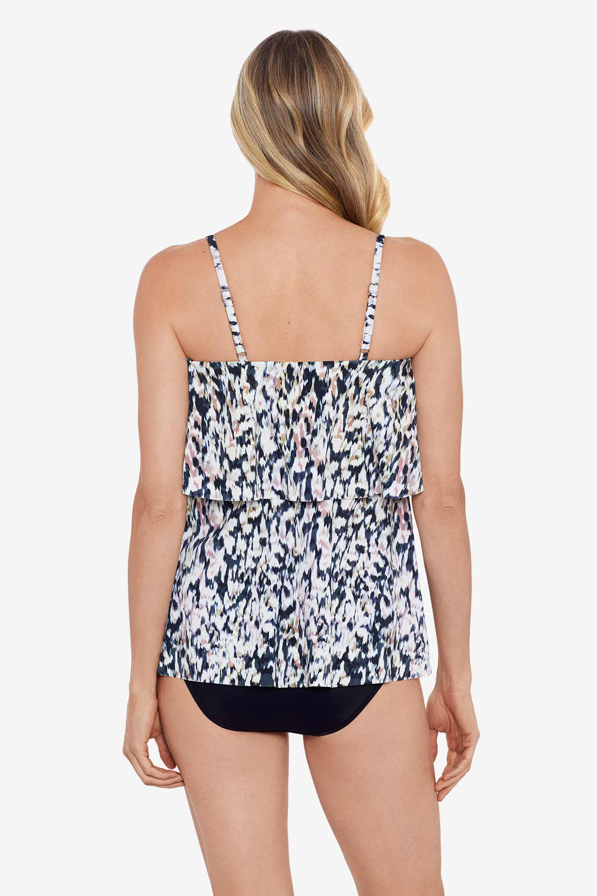 Woman faced away wearing a leopard printed single tier ruffle tankini top