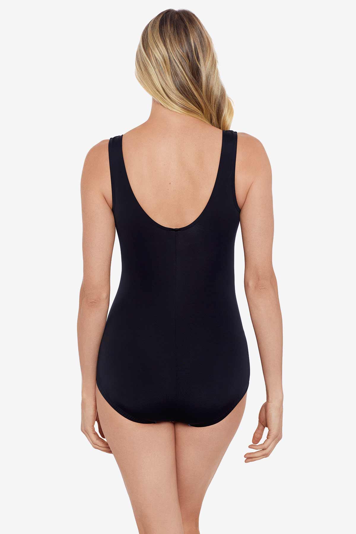 Woman faced away wearing a one-piece swimsuit