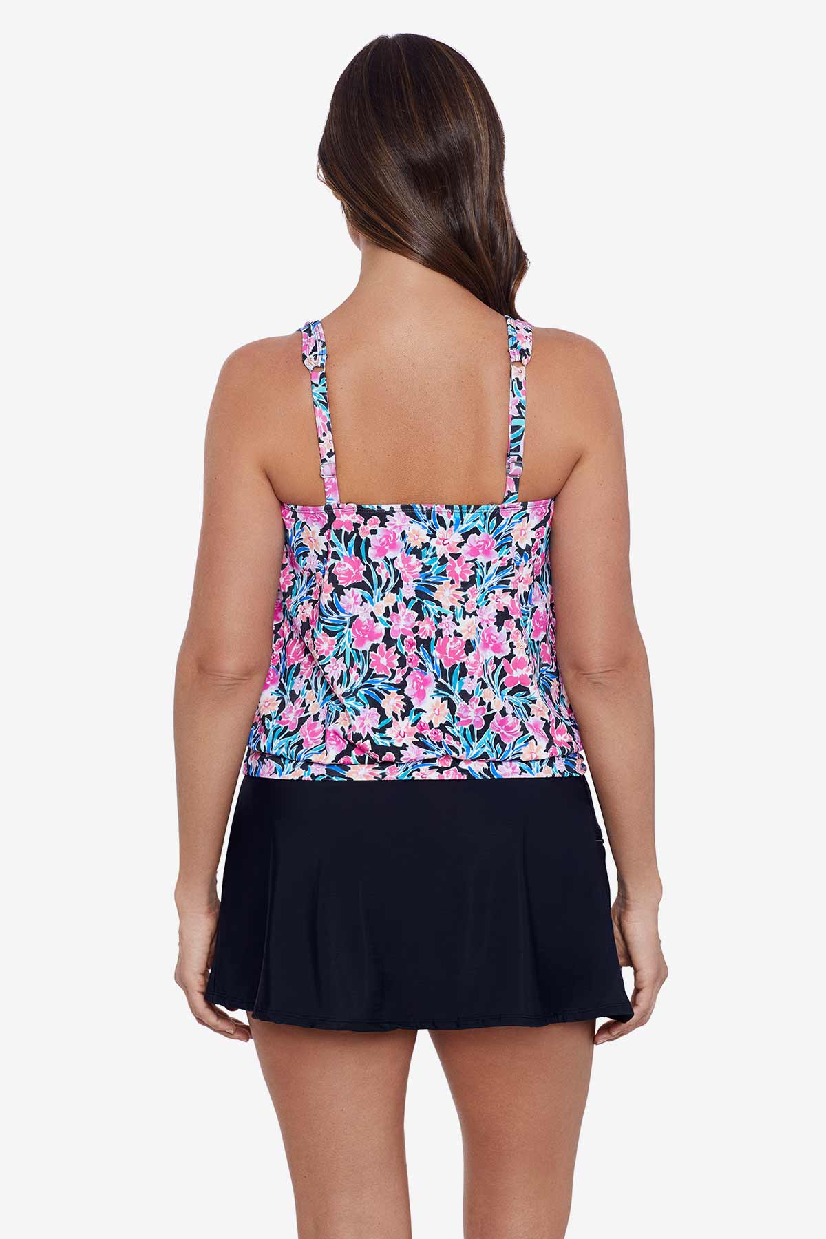 Woman turned away wearing a multicolored floral printed blouson tankini top