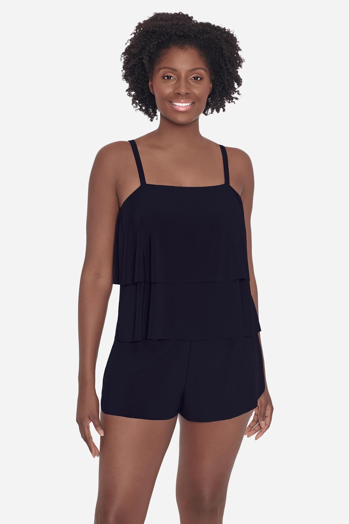 Woman wearing a black tankini top with ruffles