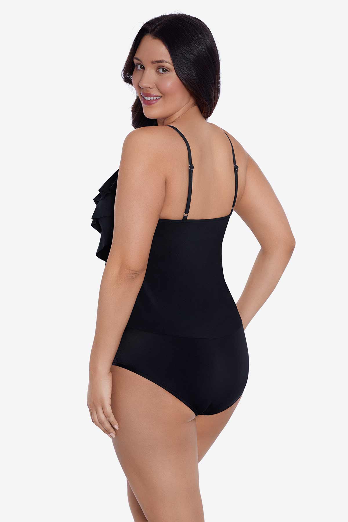 Woman faced left wearing a black tankini top with ruffles
