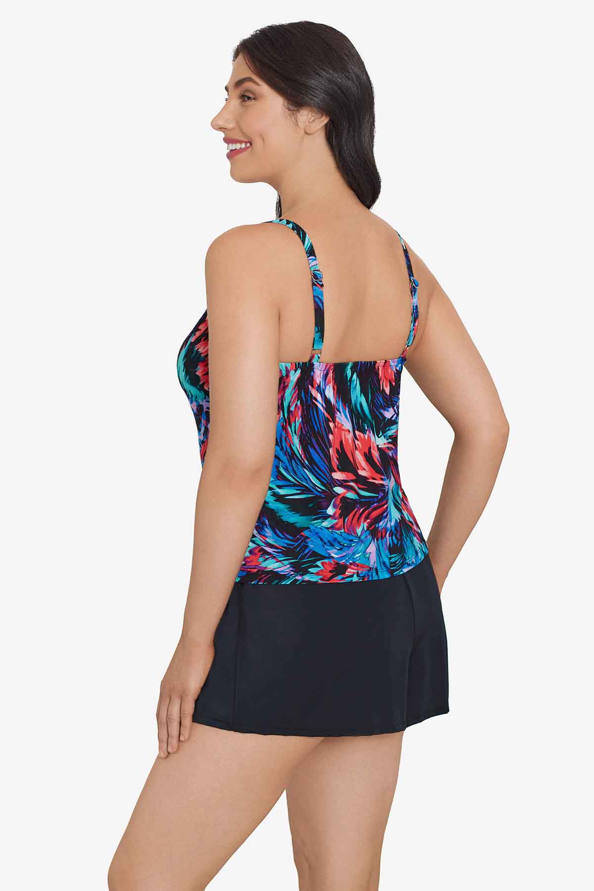 Woman turned left wearing a multicolored feather pattern swim romper