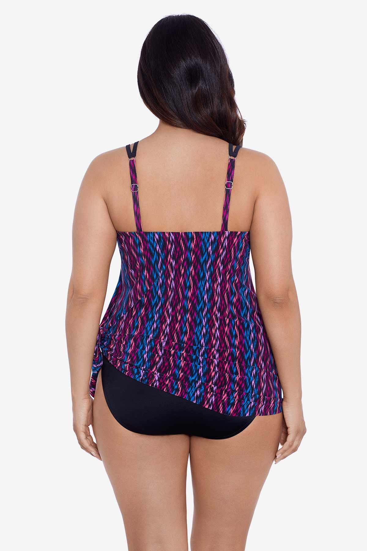 Woman faced away wearing a purple and blue stripey pattern swim dress tied at the side