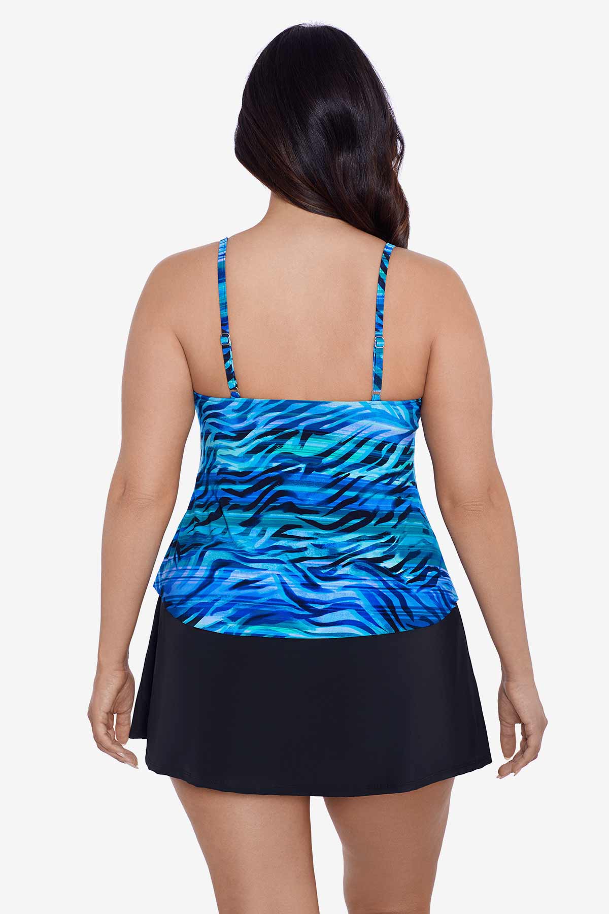 Woman faced away wearing a blue wave printed tankini top