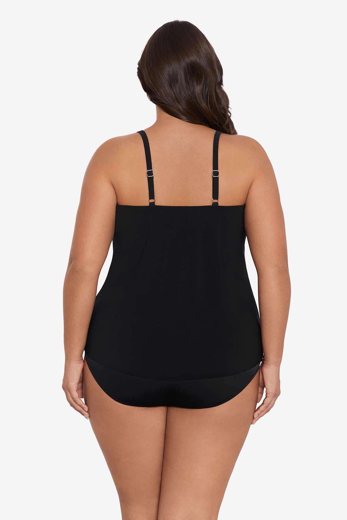 Woman turned away wearing a black tankini top