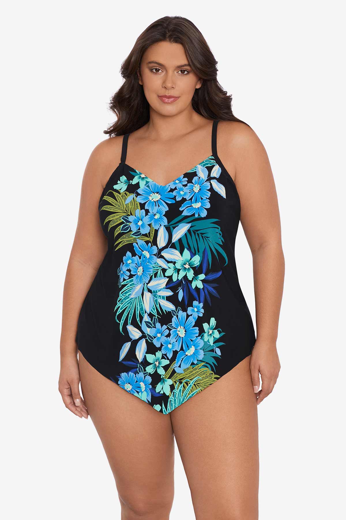Woman wearing a black tankini top with a blue floral pattern down the front