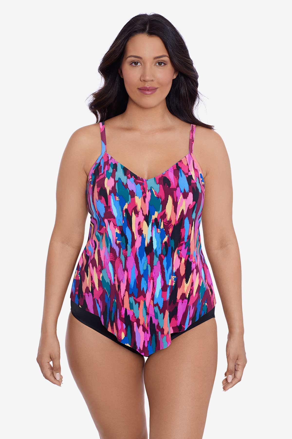 Woman wearing a multicolored collage print tankini top