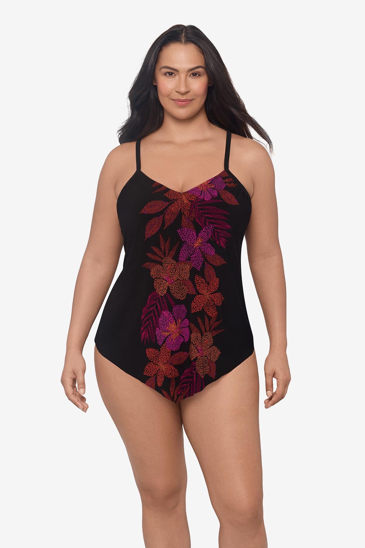 Woman wearing a pink and orange floral printed tankini top