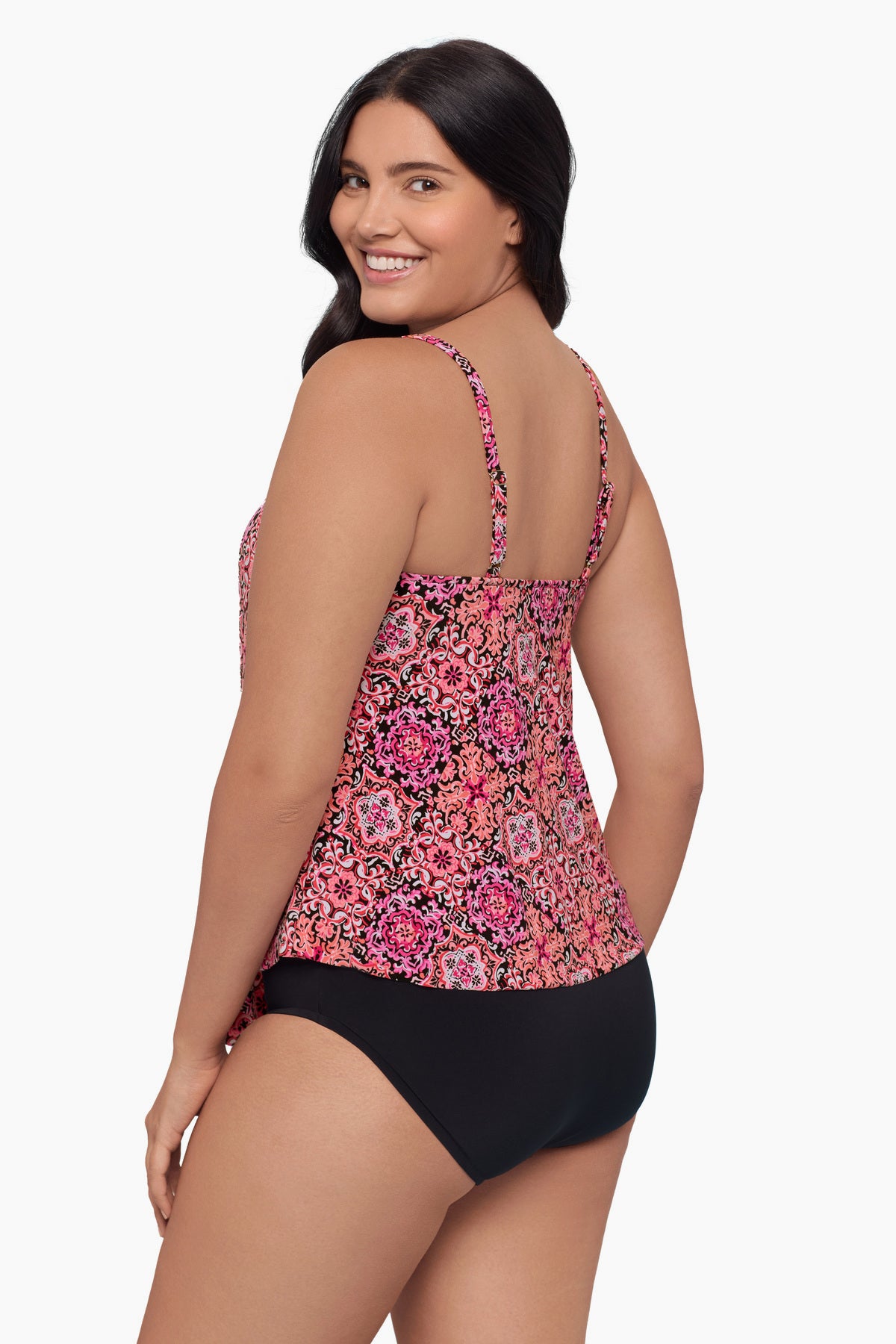 Woman faced left wearing a tiered tankini top with a pink tile pattern