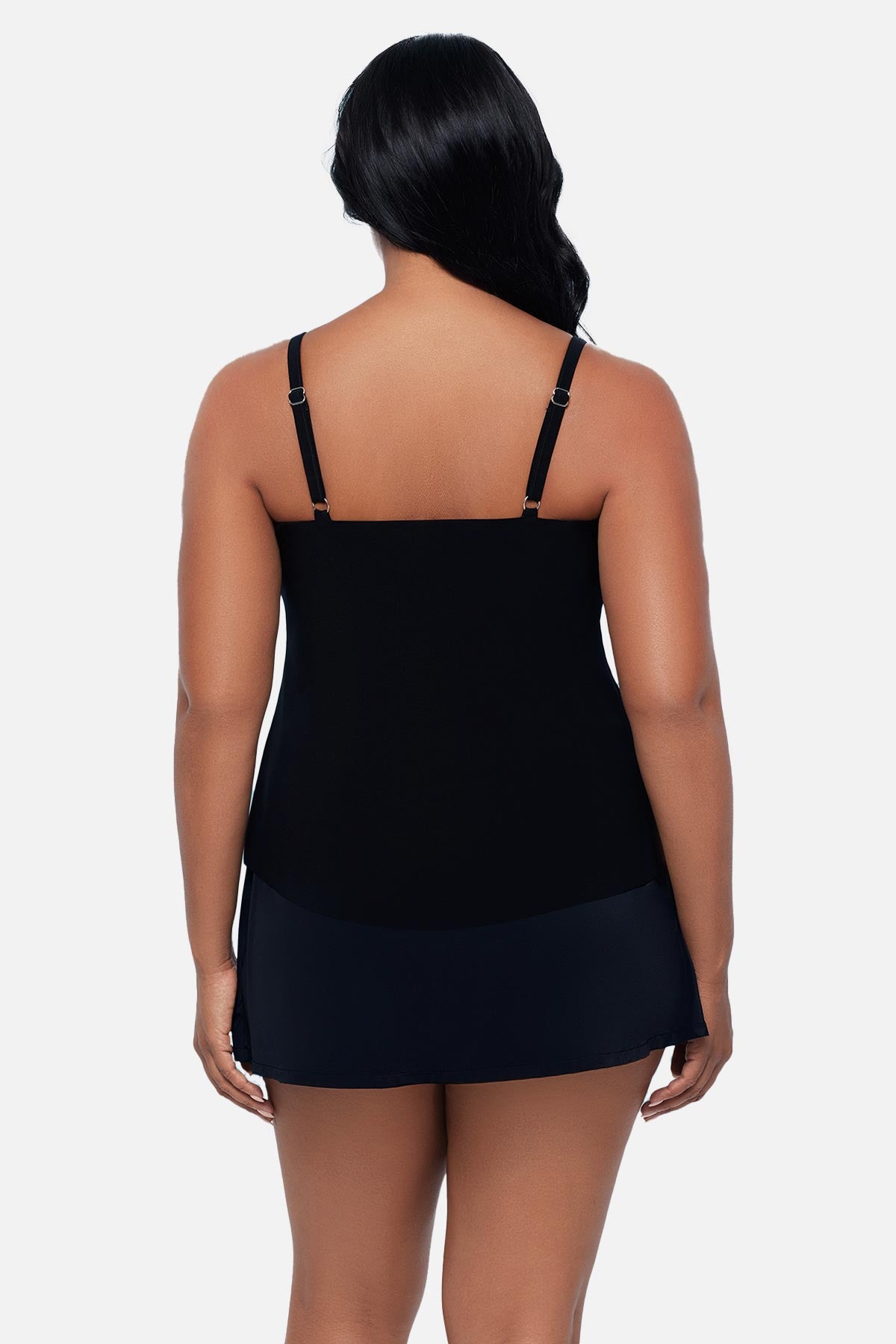 Woman turned away wearing a black floral tankini top