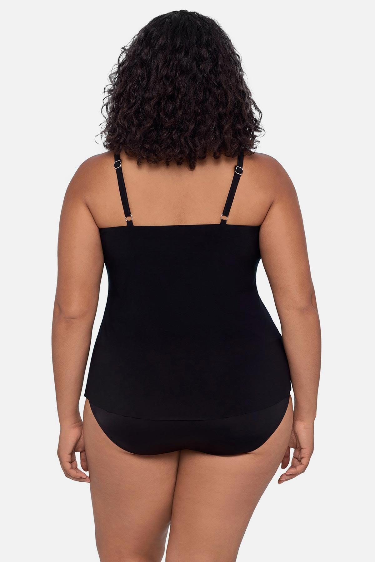 Woman turned away wearing a pink ombre tankini top