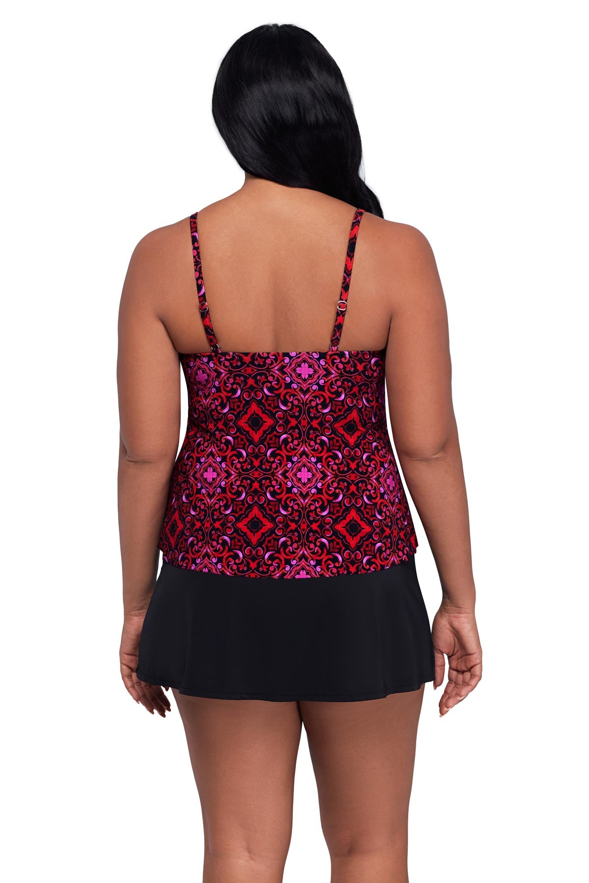 Woman turned away wearing a pink and red tile print tankini top
