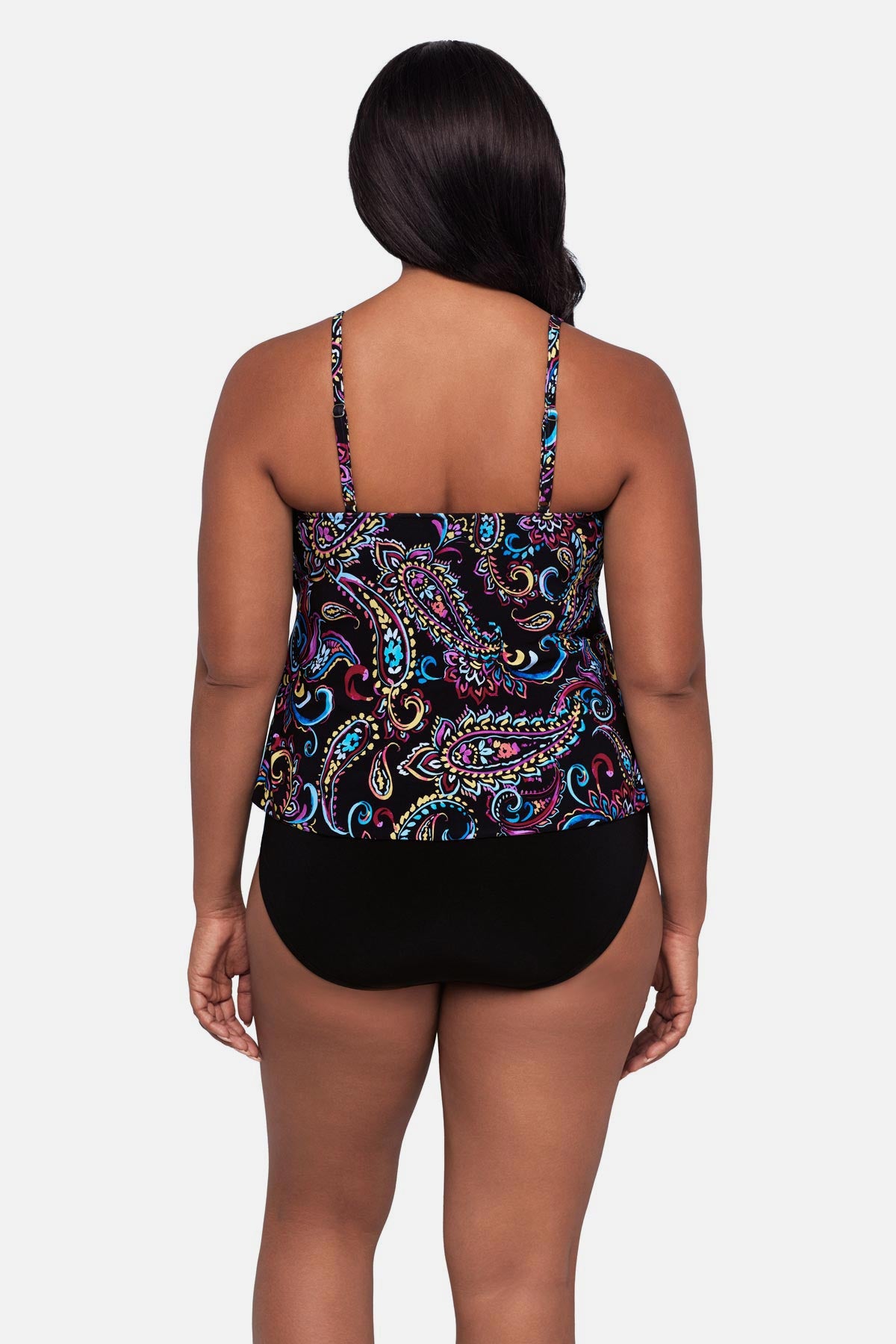 Woman turned away wearing a multicolored paisley printed tankini top with ruffles