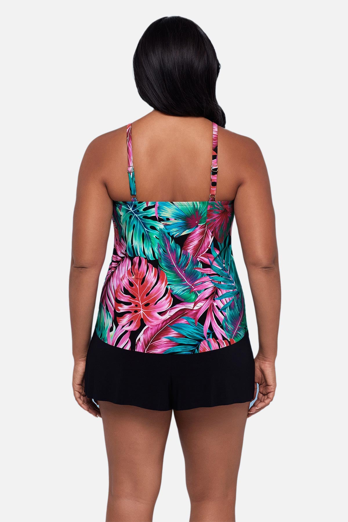 Woman turned away wearing a multicolor palm leaf printed tankini