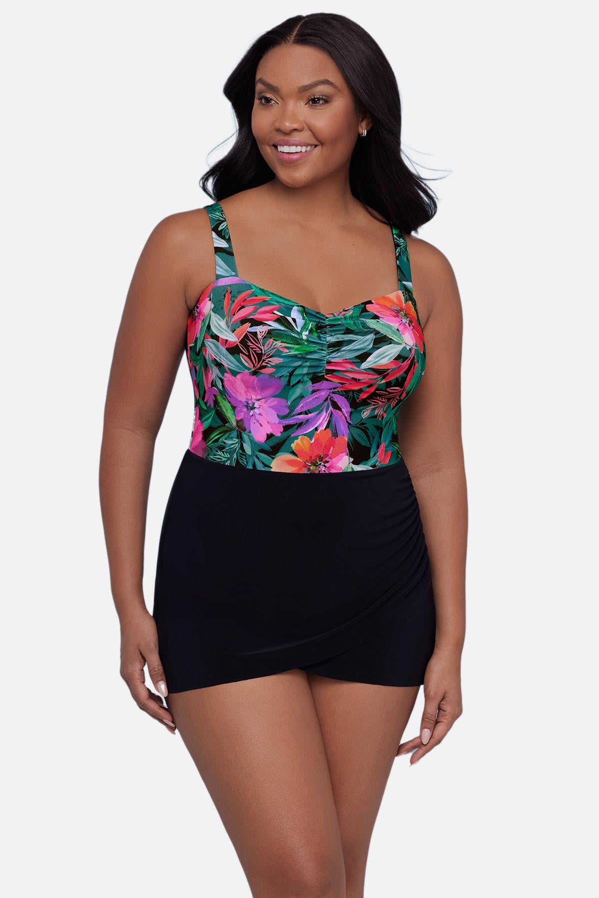 Woman wearing a multicolor floral and leaf printed swim dress