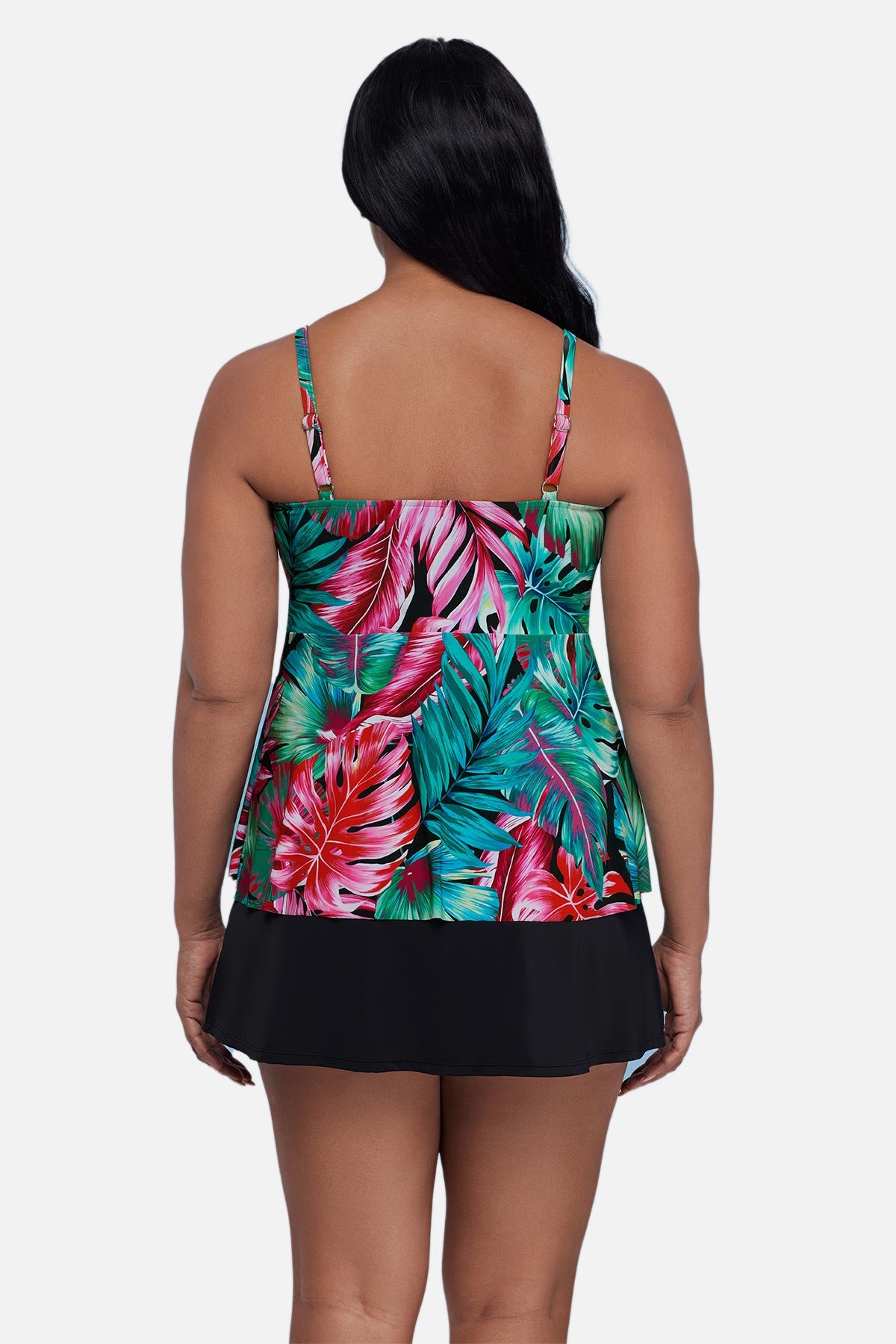 Woman turned away wearing a multicolor palm leaf printed tankini top