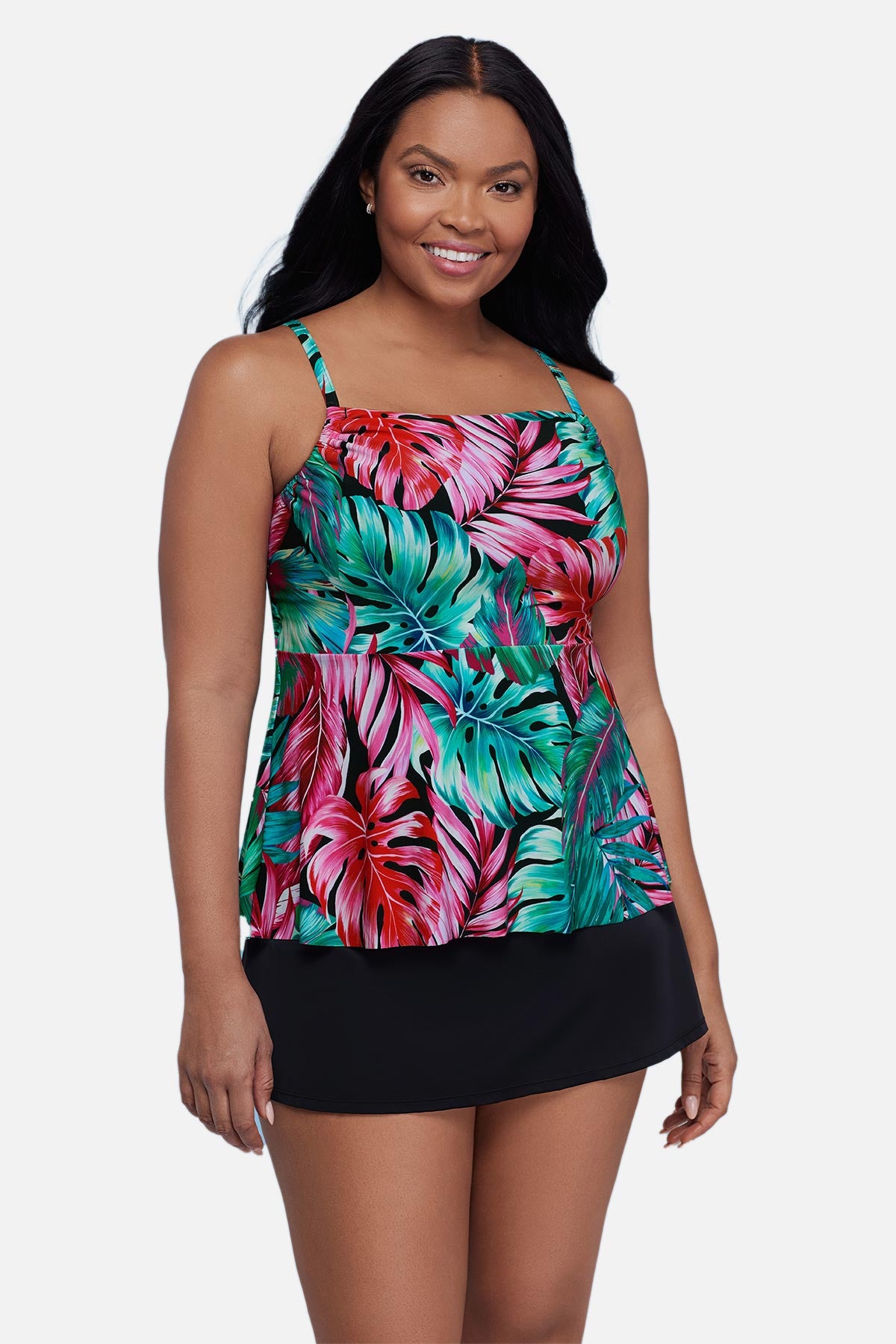 Woman wearing a multicolor palm leaf printed tankini top