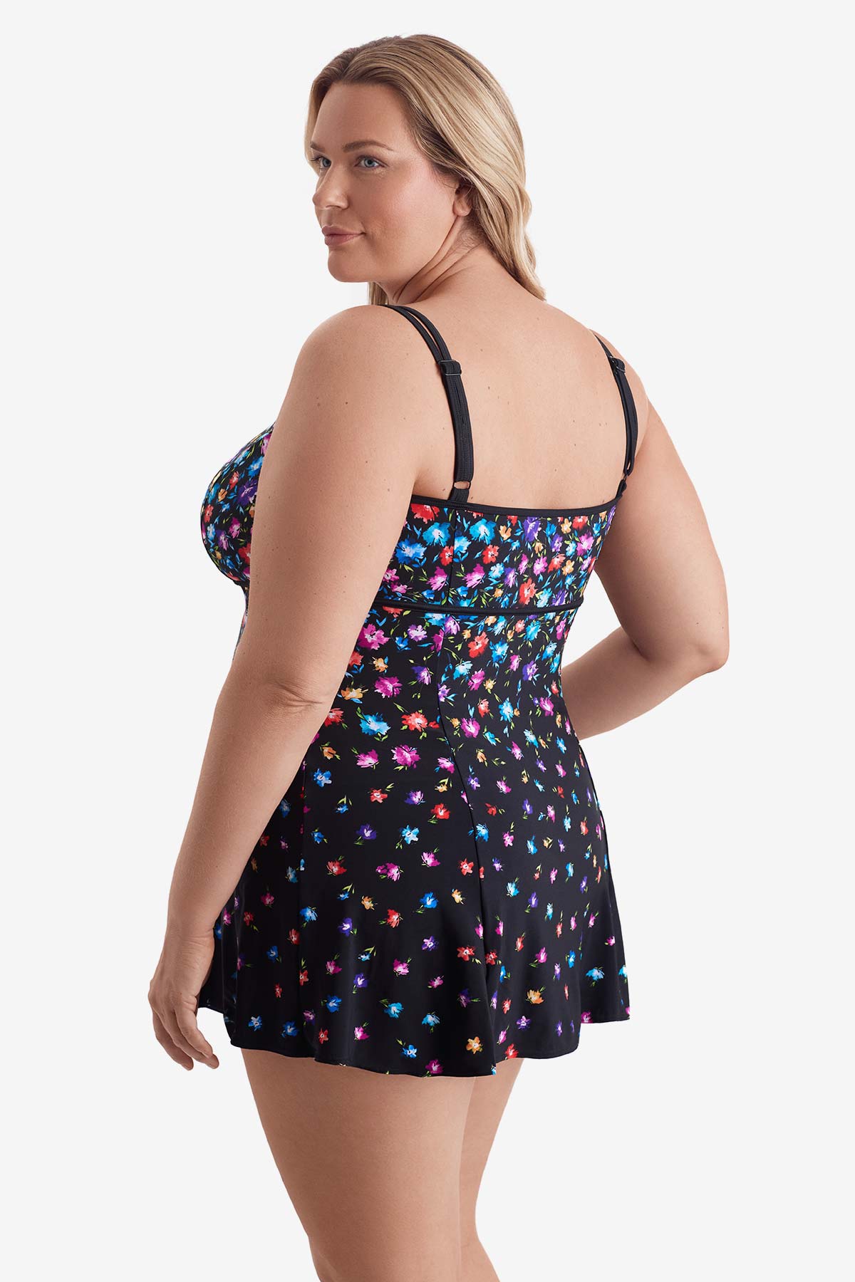 Woman turned left wearing a multicolored floral printed pattern swim dress