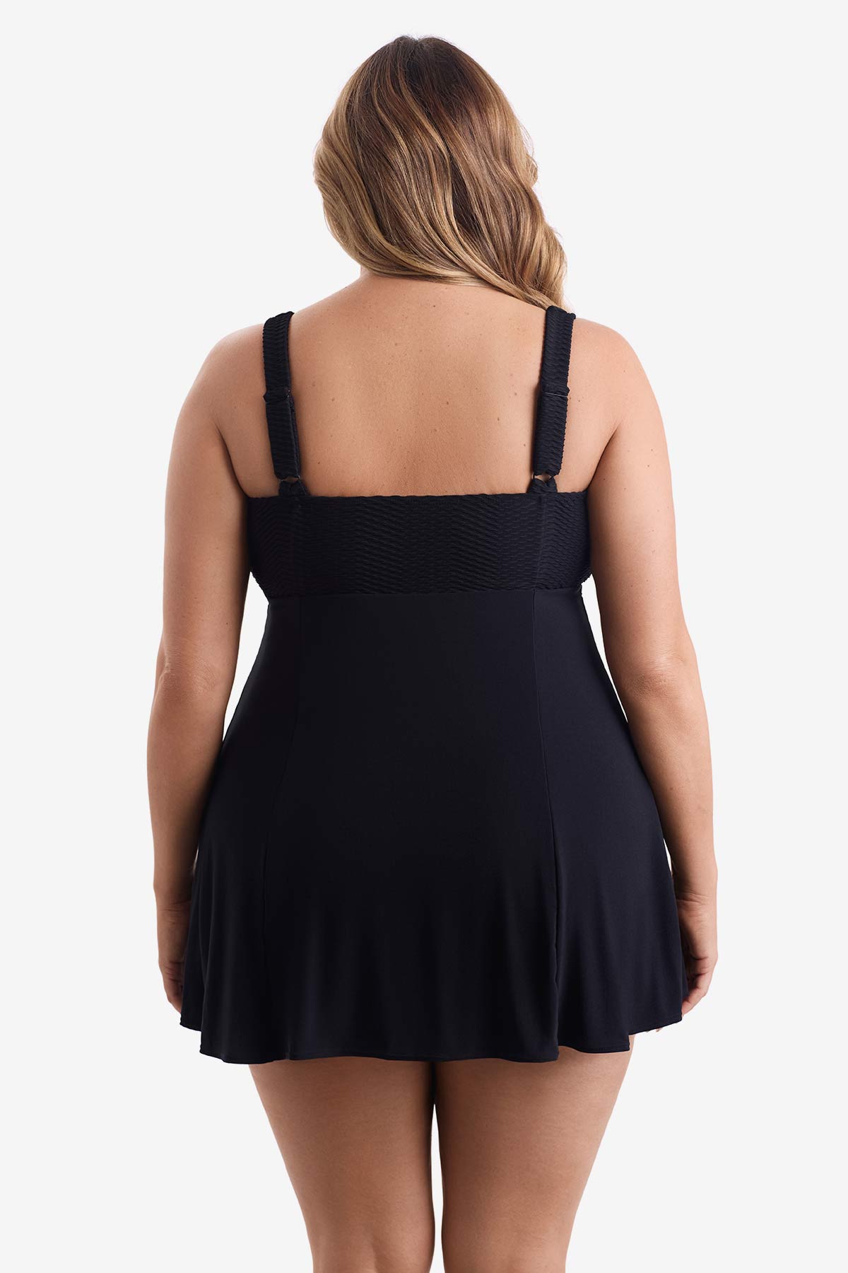 Woman turned away wearing a black swim dress