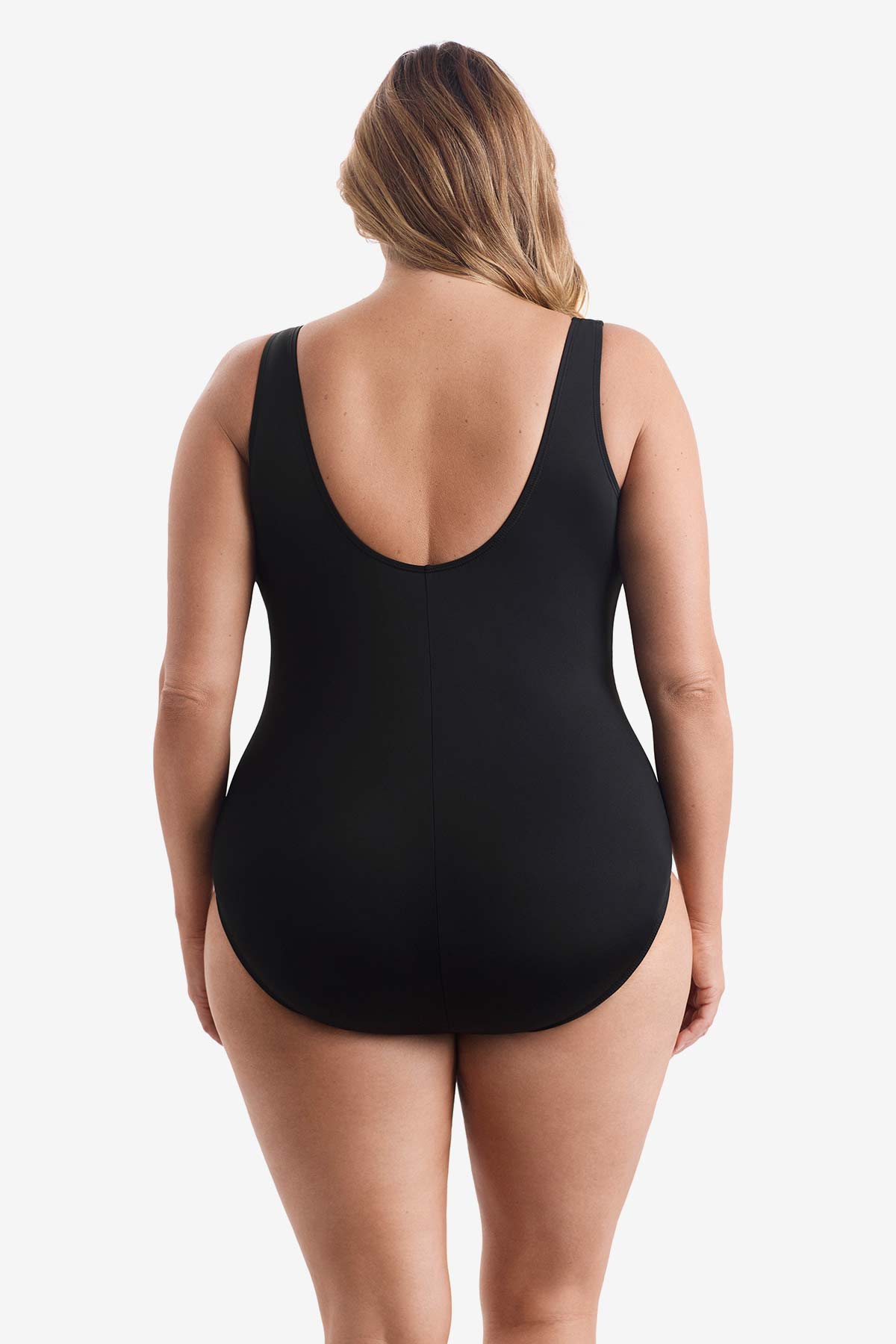 Woman turned away wearing a wrap-sash one-piece swimsuit