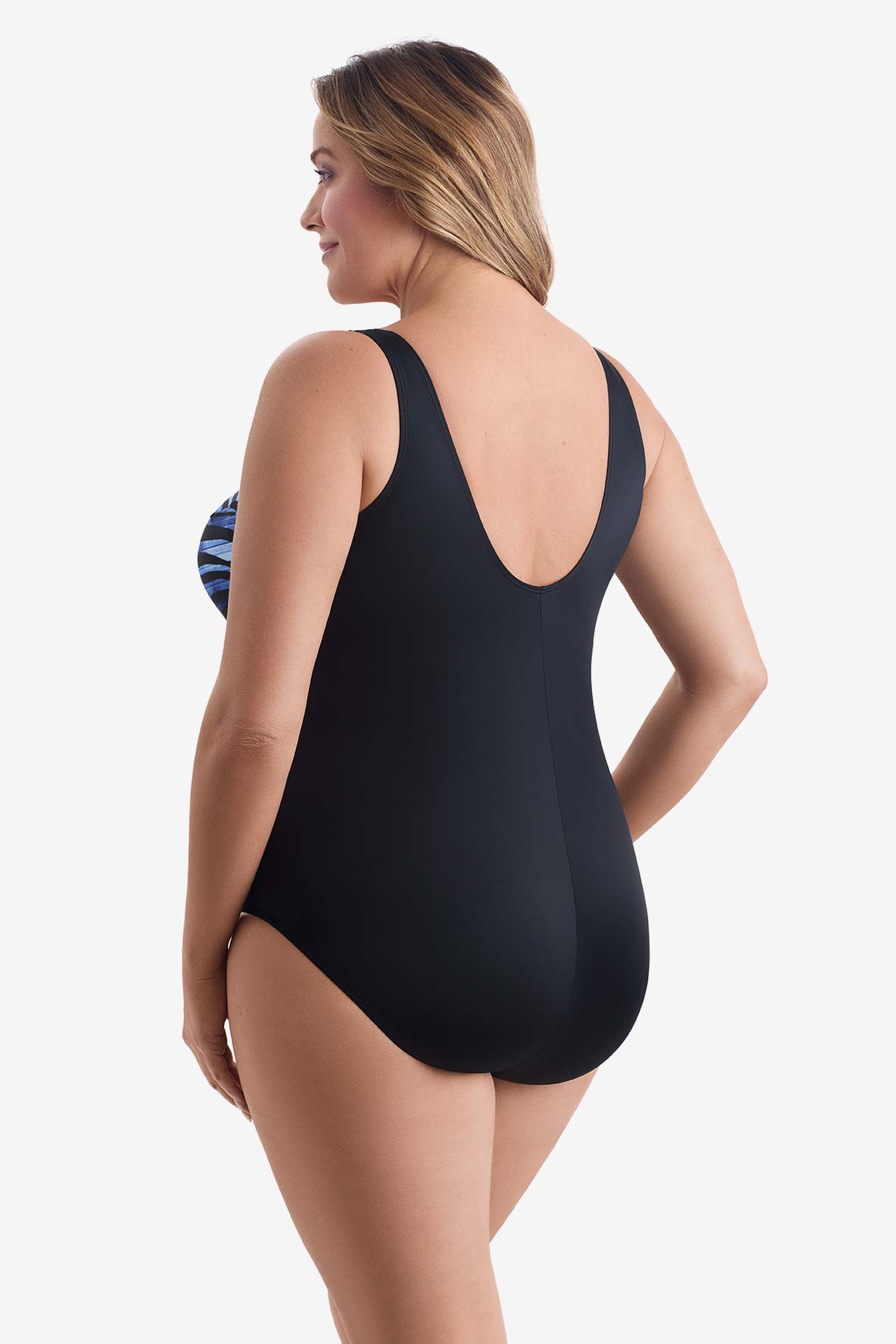 Woman faced left wearing a black and blue striped one-piece swimsuit