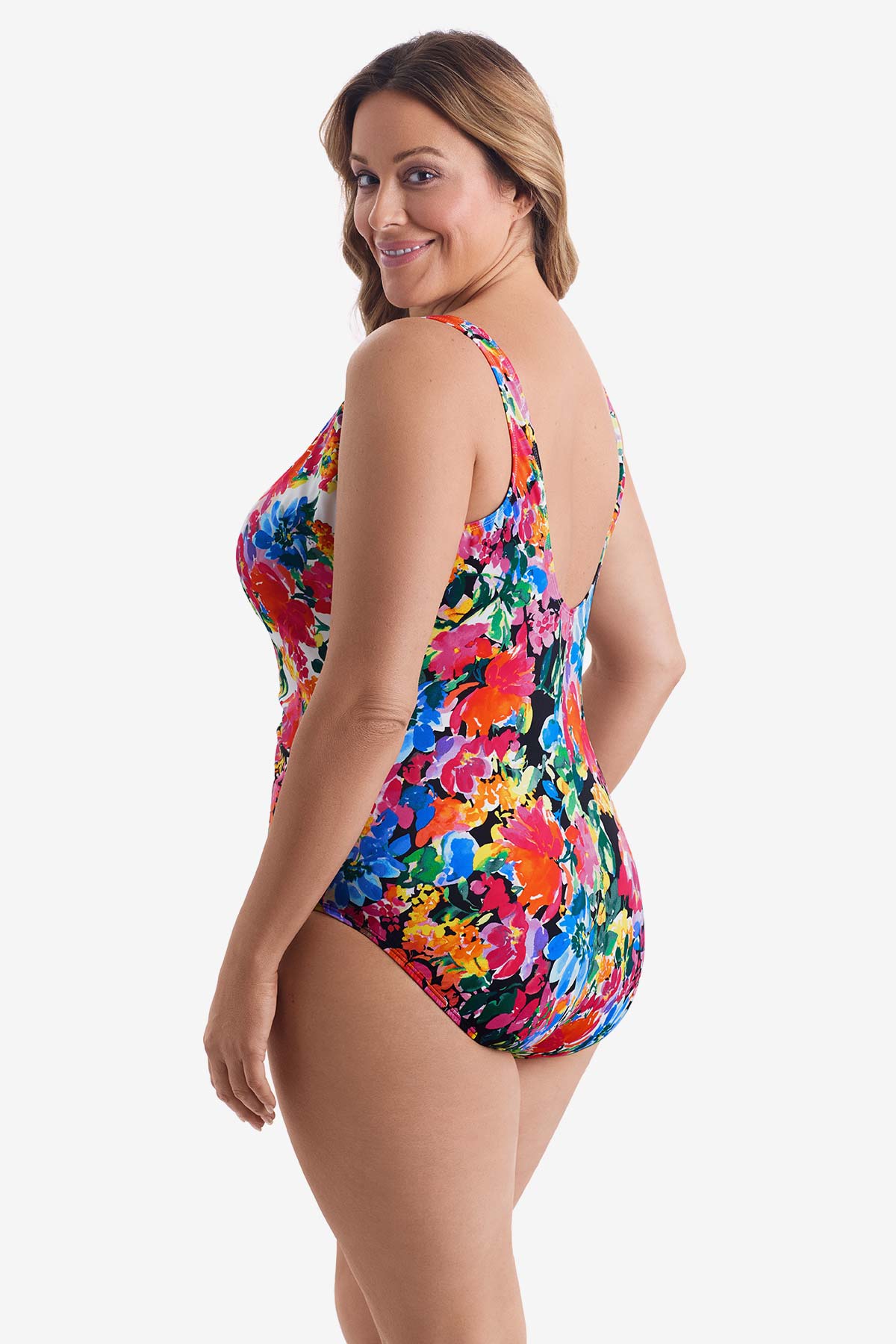 Woman turned left wearing a multicolored floral one-piece swimsuit
