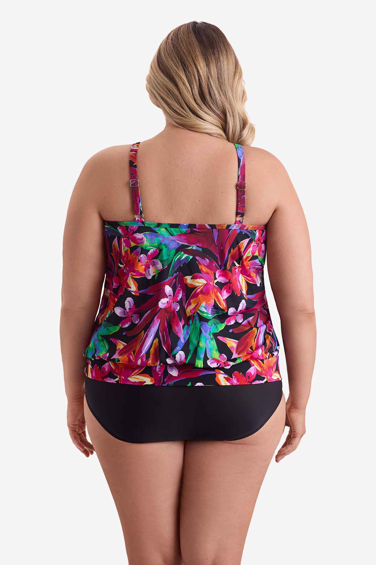 Woman wearing a multicolored floral printed blouson tankini top