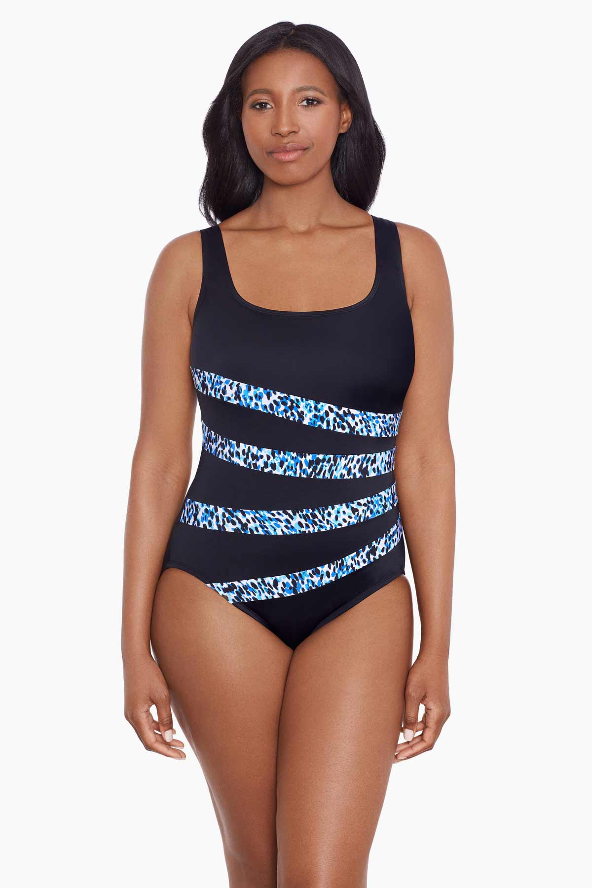 Woman wearing a dotted print four streak one-piece swimsuit