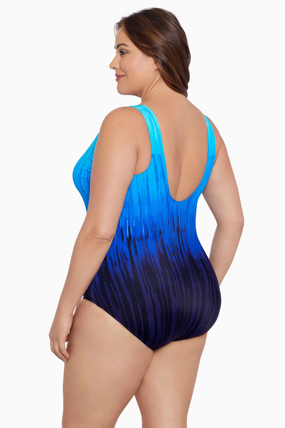 Woman turned left wearing a blue ombre streaked print one-piece swimsuit