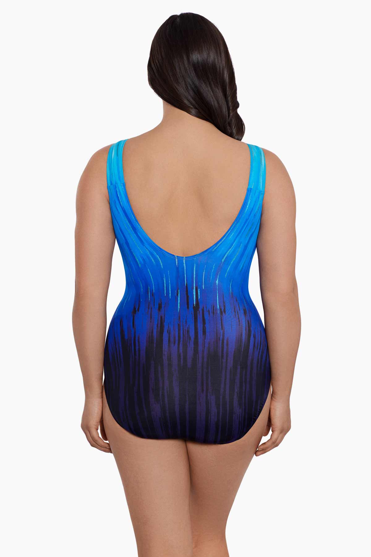 Woman turned away wearing a blue ombre streaky pattern one piece swimsuit