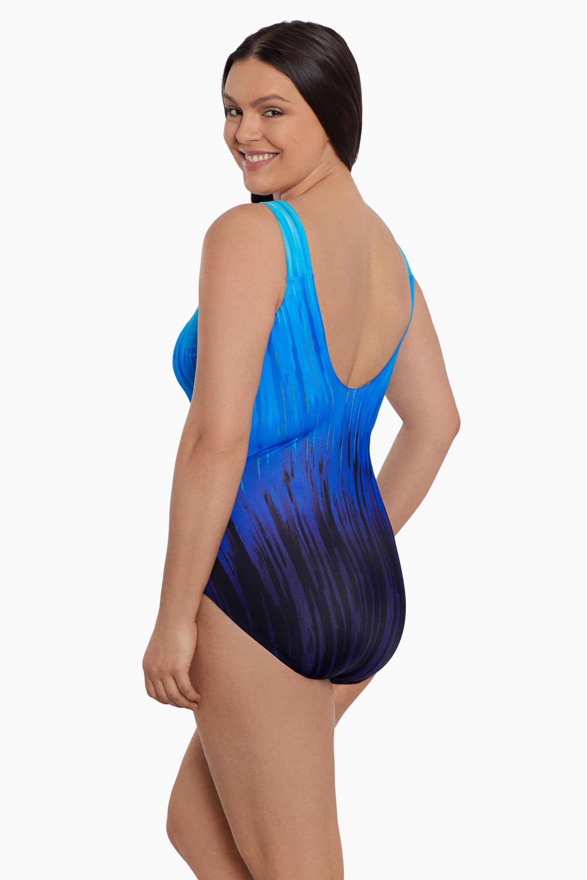 Woman turned left wearing a blue ombre streaky pattern one piece swimsuit