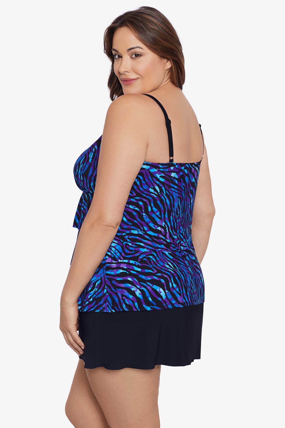Woman turned left wearing a blue animal-esque printed ruffle skirtini swimsuit