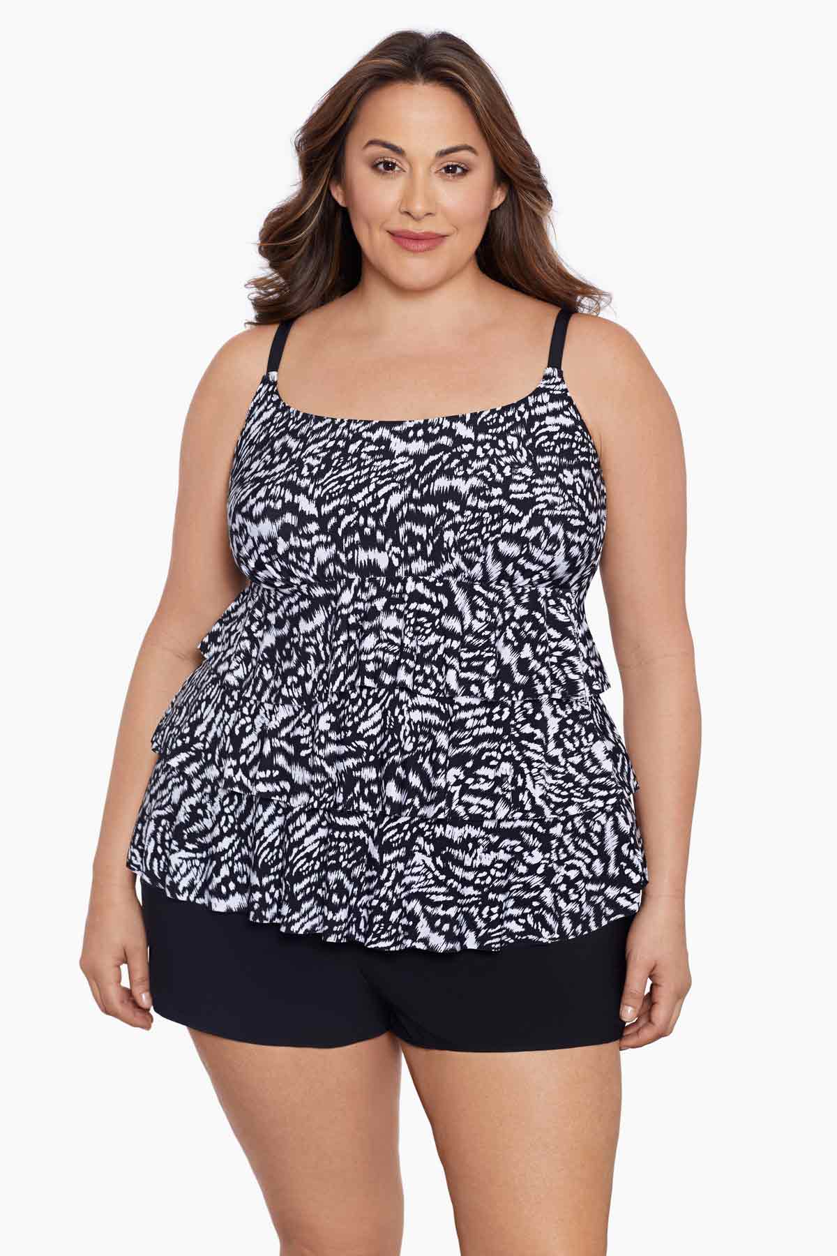 Woman wearing a black and white abstract printed ruffle shortini
