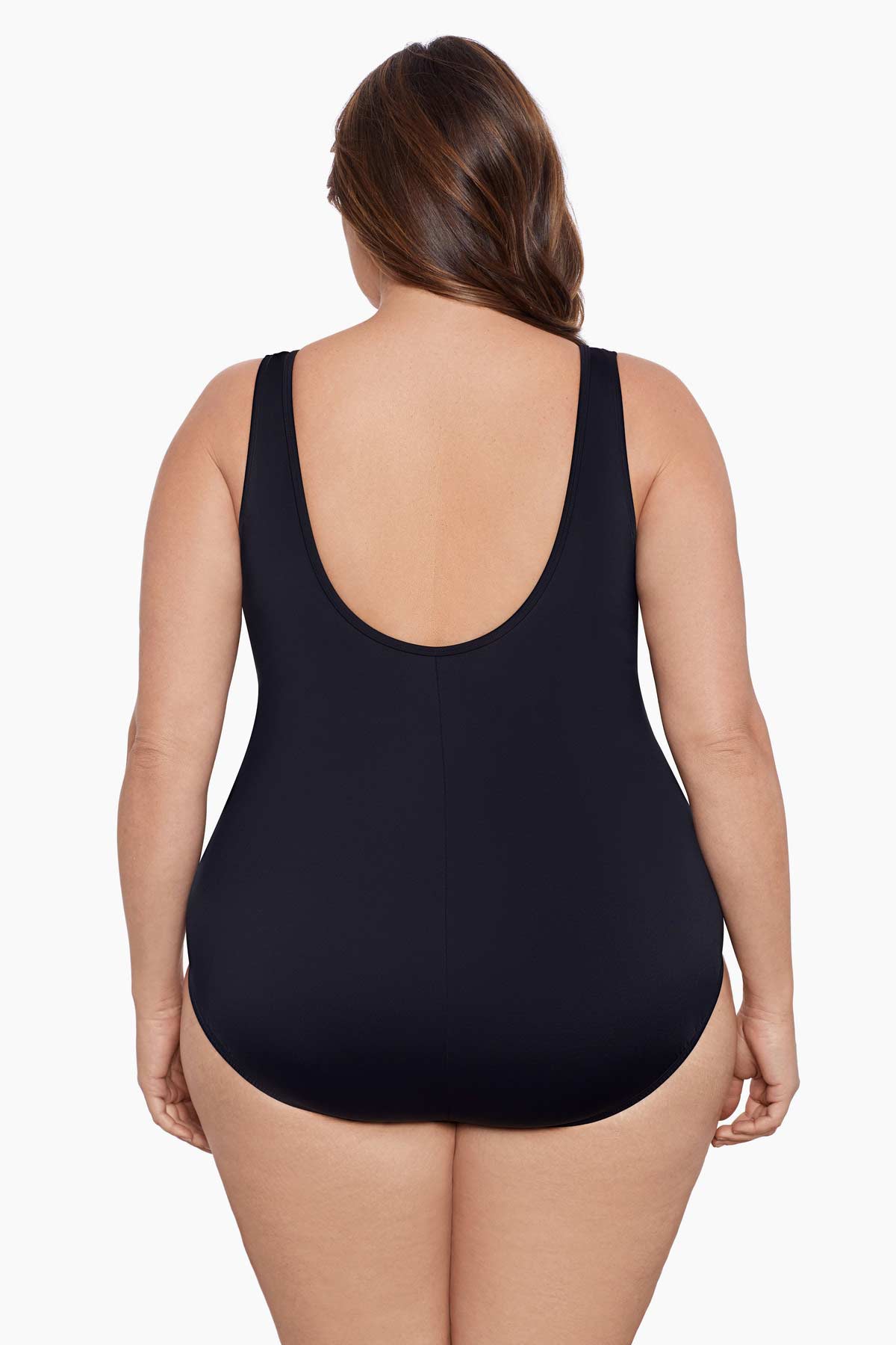 Woman faced away wearing a black blocked one-piece swimsuit