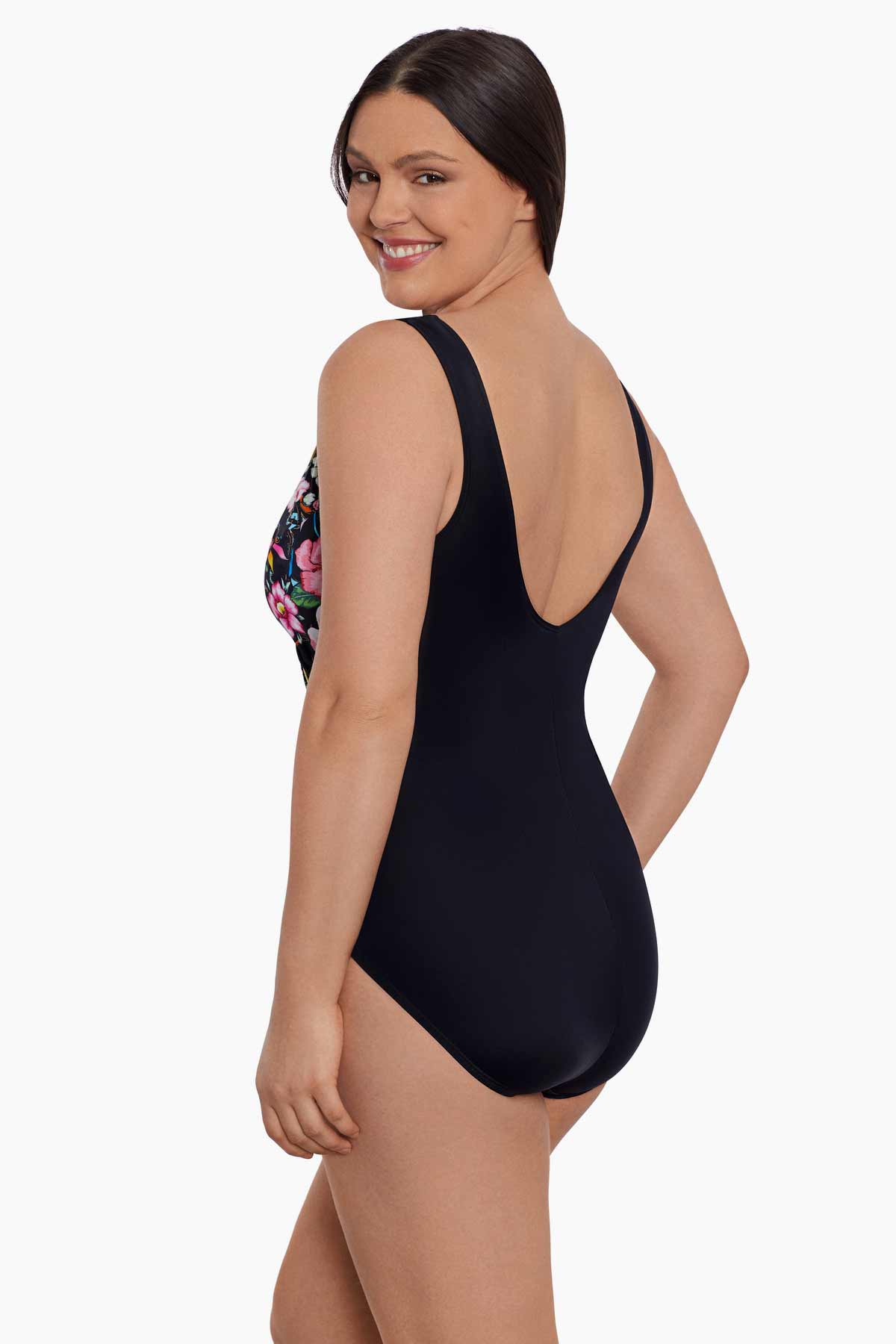 Woman turned left wearing a floral printed one-piece swimsuit