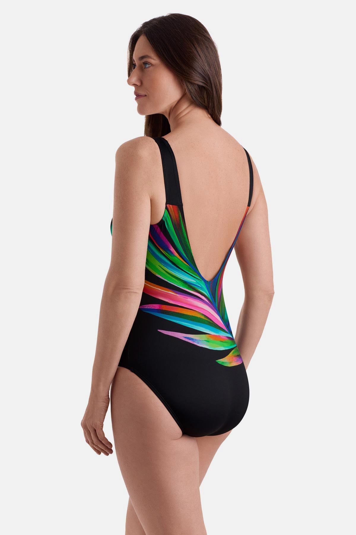 Woman turned left wearing a multicolored feather print one-piece swimsuit