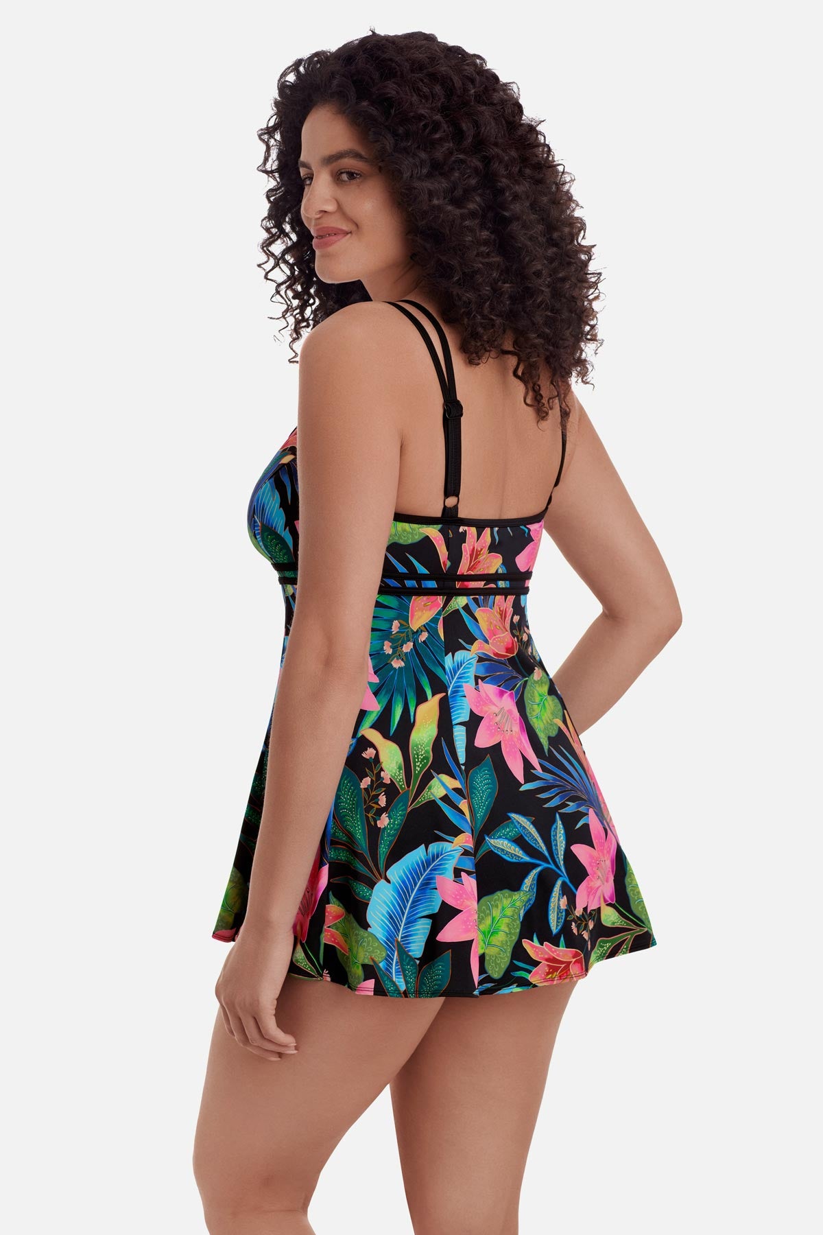 Woman faced left wearing a multicolored floral printed swim dress