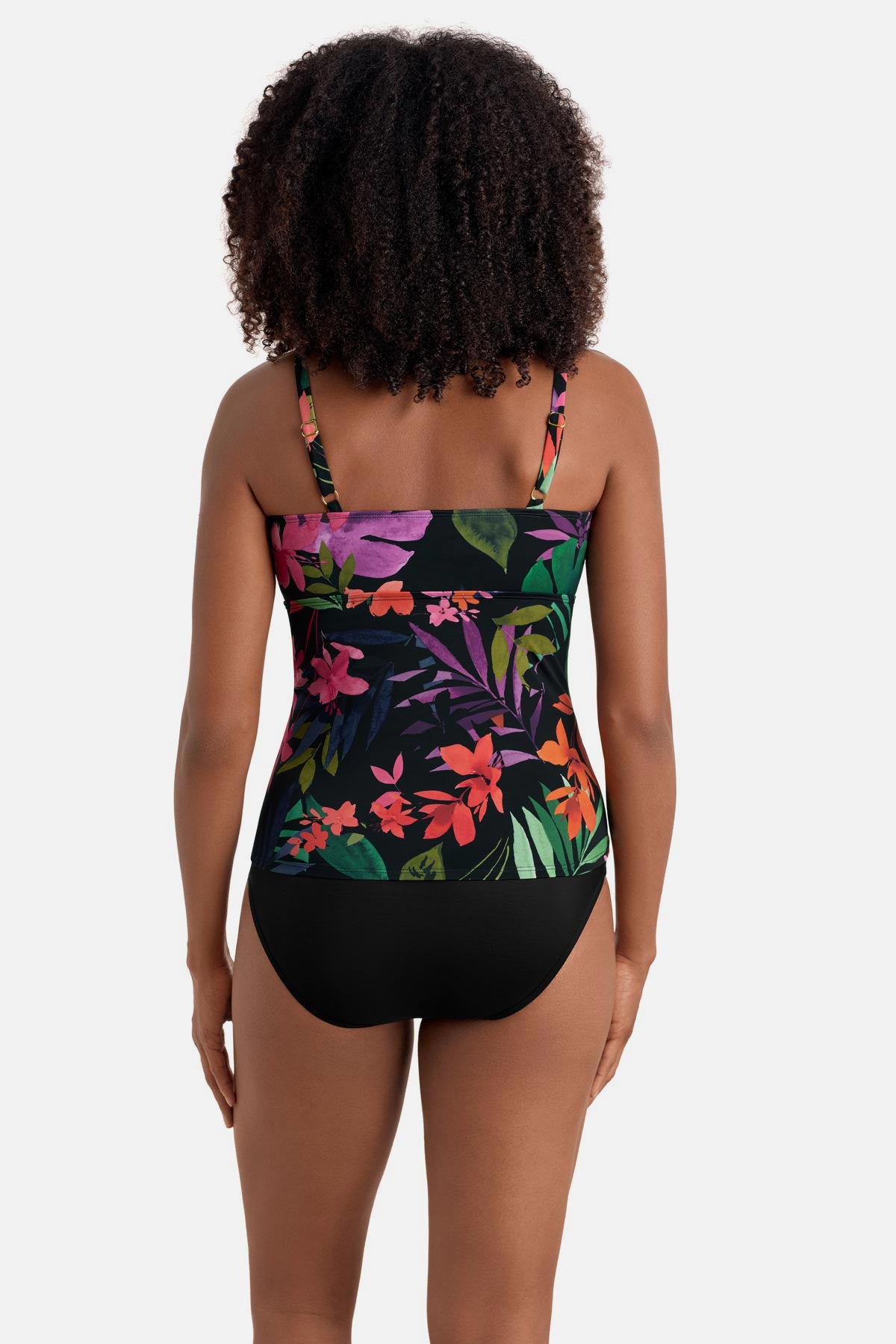 Woman turned away wearing a multicolored floral printed shirred tankini top