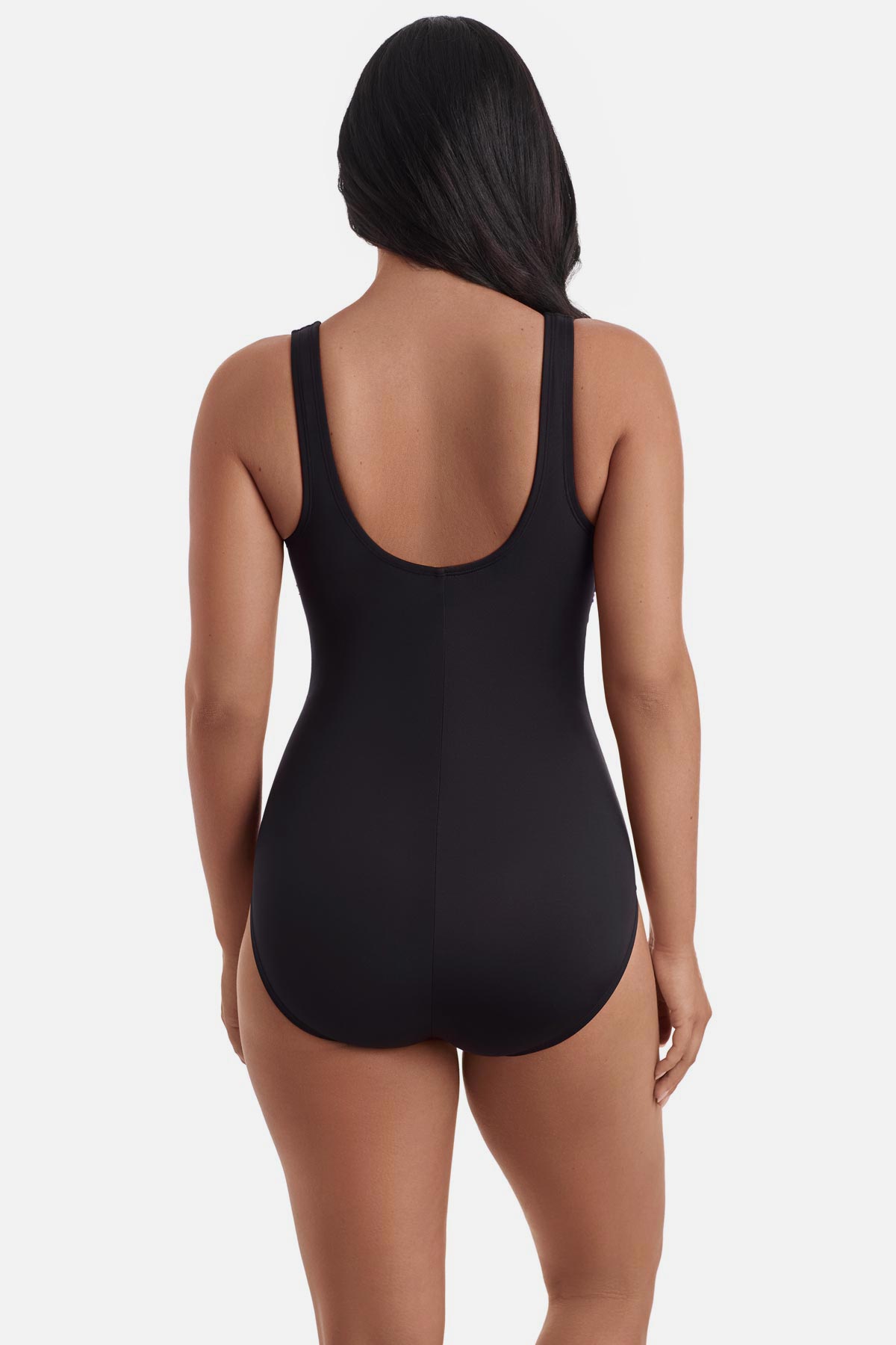 Woman turned away wearing a rainbow tie dye-esque one-piece swimsuit