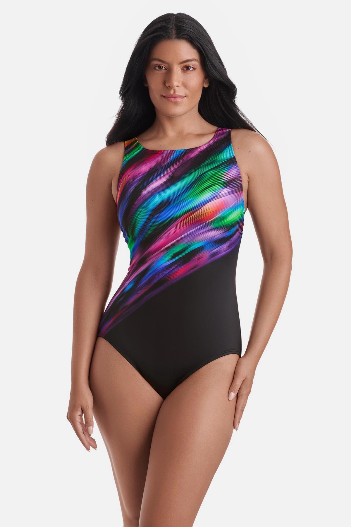 Woman wearing a rainbow tie dye-esque one-piece swimsuit