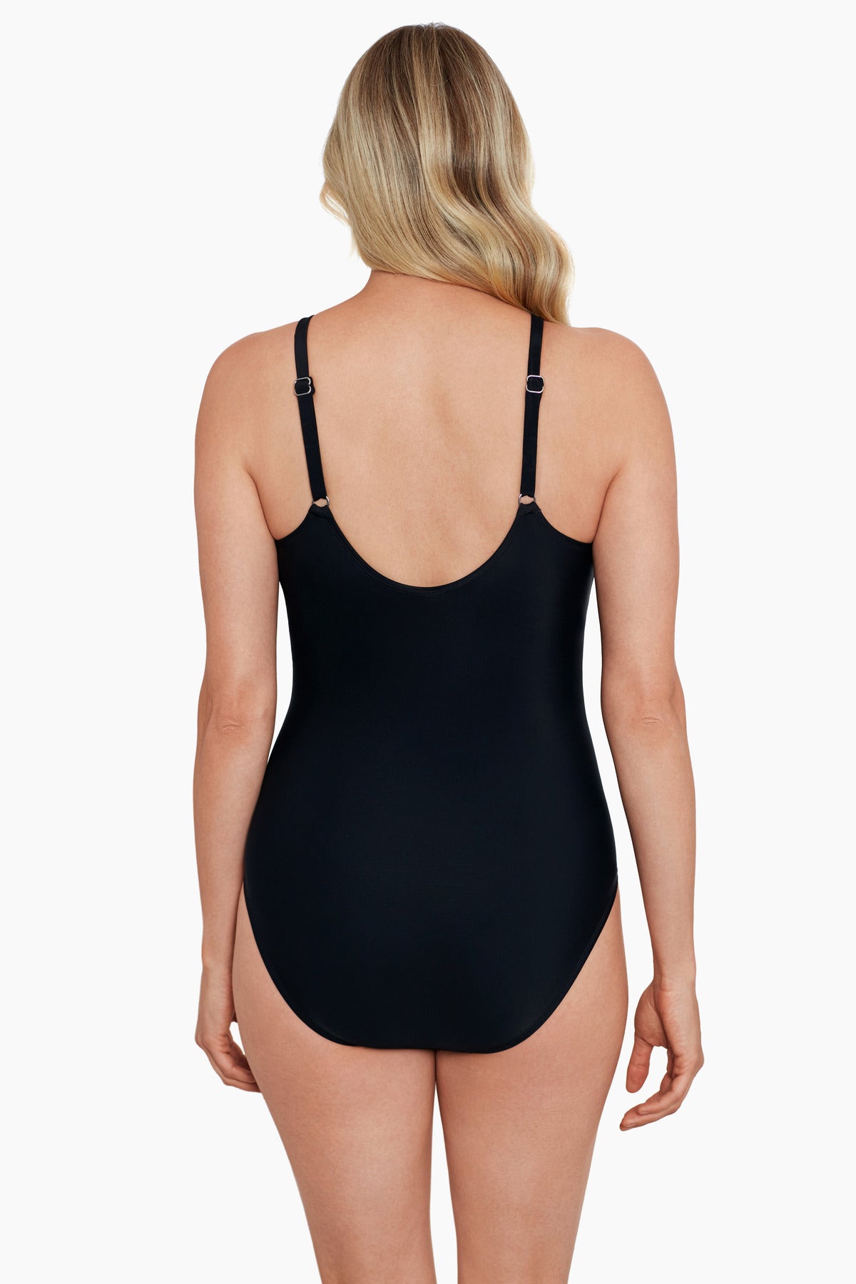 Woman faced away wearing a multicolored paisley printed draped high neck one-piece swimsuit with keyhole detail