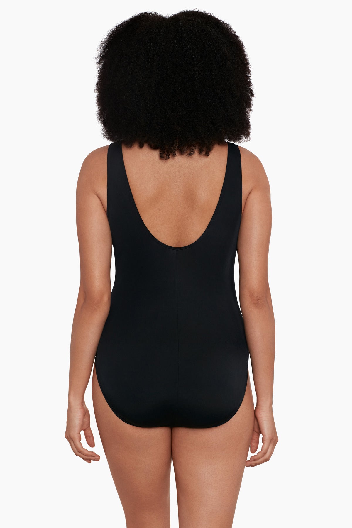 Woman turned away wearing a rainbow paint brush pattern one-piece swimsuit