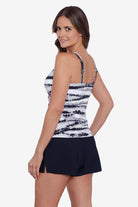 Woman faced left wearing a black and white tie dye tankini top