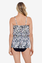 Woman faced away wearing a leopard printed single tier ruffle tankini top