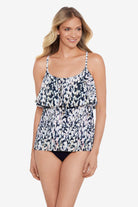 Woman wearing a leopard printed single tier ruffle tankini top