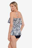 Woman turned left wearing a leopard printed single tier ruffle tankini top
