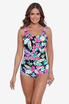 Woman wearing a floral printed one-piece swimsuit