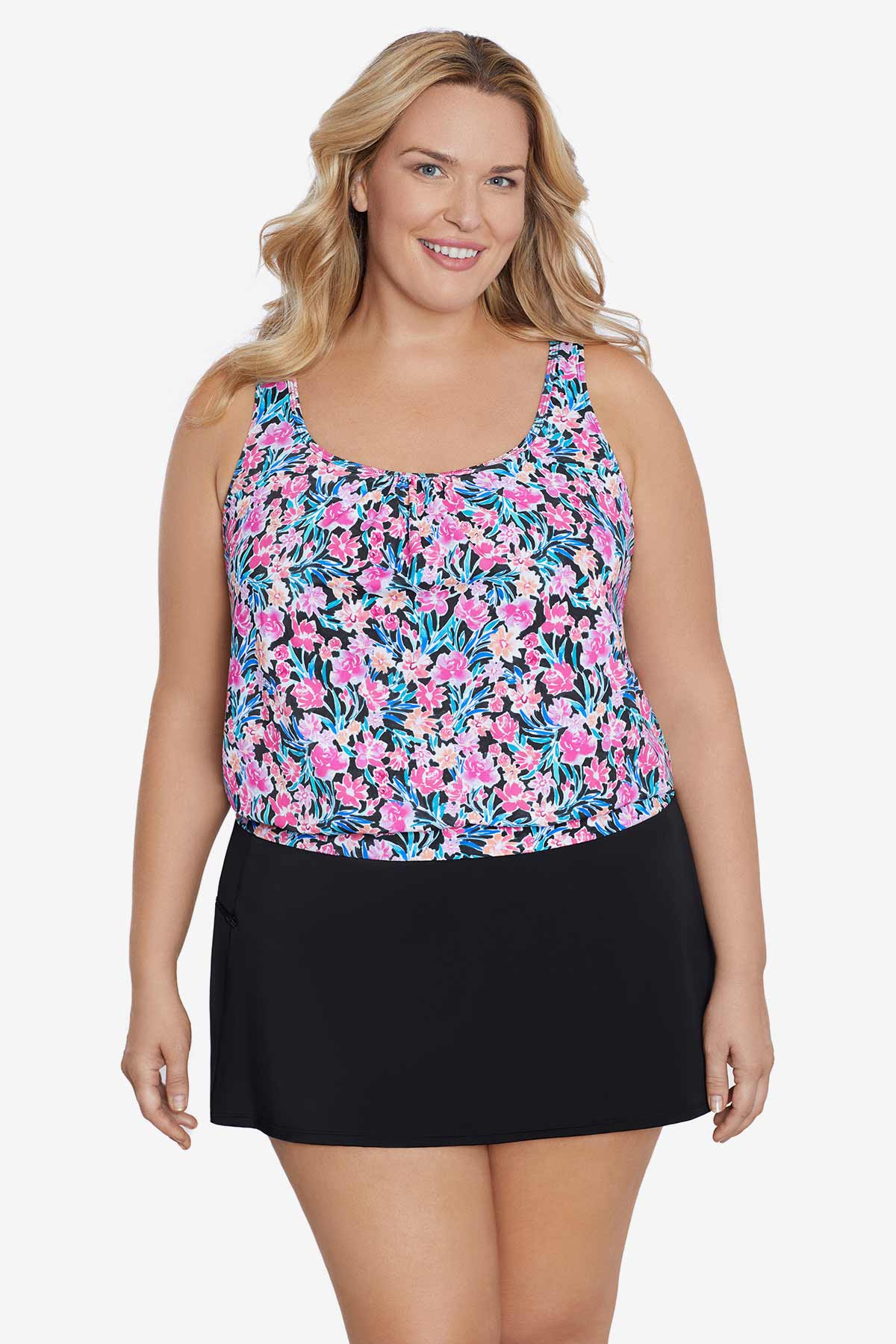 Woman wearing a multicolored floral printed blouson tankini top