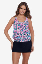 Woman wearing a multicolored floral printed blouson tankini top